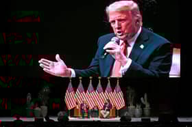 Donald Trump is projected on a giant screen during a live interview with US commentator Tucker Carlson in Glendale, Arizona (Picture: Patrick T Fallon)