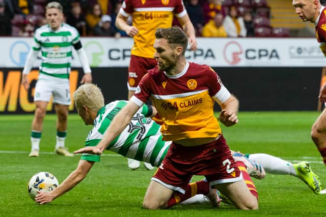 Celtic's Daizen Maeda scores before it is ruled out for a handball after a VAR check - but a penalty should have been awarded for a foul by Motherwell's Stephen O'Donnell. (Photo by Craig Foy / SNS Group)
