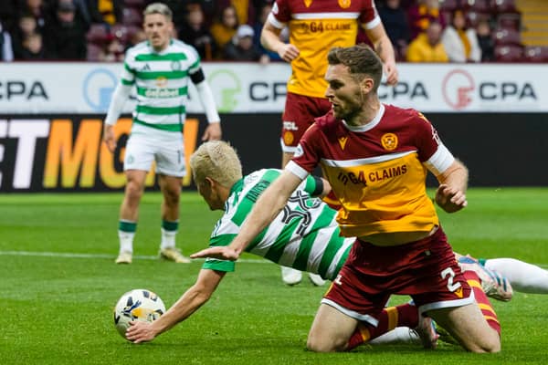 Celtic's Daizen Maeda scores before it is ruled out for a handball after a VAR check - but a penalty should have been awarded for a foul by Motherwell's Stephen O'Donnell. (Photo by Craig Foy / SNS Group)