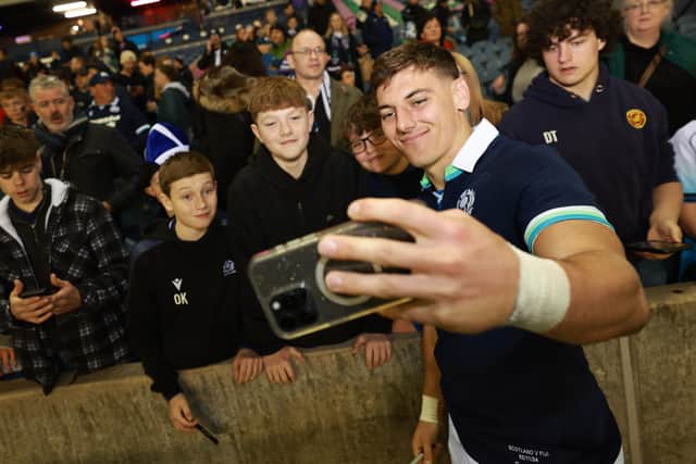 Jordan takes some selfies with Scotland fans.