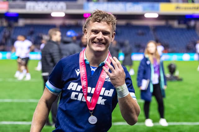 Darcy Graham celebrates his four-try haul for Scotland against Fiji.