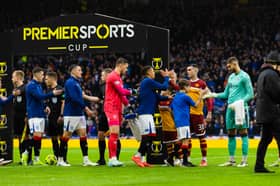 Rangers and Motherwell players shake hands before the Premier Sports Cup semi-final at Hampden. (Photo by Craig Foy / SNS Group)