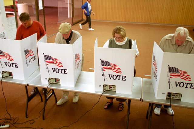Several US states have increased security around polling stations and election staff amid fears of violence (Picture: Joe Raedle/Newsmakers)