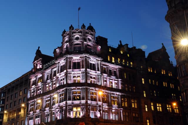 Jenners, Princes Street, Edinburgh, building lit up at night.