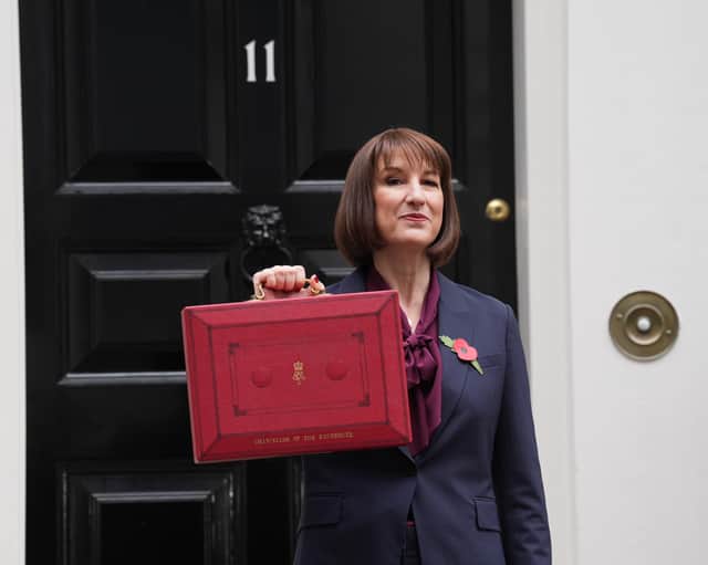 Chancellor Rachel Reeves poses outside 11 Downing Street with her ministerial red box before delivering her Budget in the House of Commons