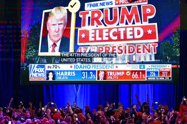 Donald Trump's supporters celebrate as Fox News announces he has won the US election at an event in the West Palm Beach convention centre in Florida (Picture: Jim Watson)