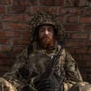 A Ukrainian soldier of the 23rd Mechanised Brigade waits to  move up to the frontline near Avdiivka earlier this year (Picture: Roman Pilipey)
