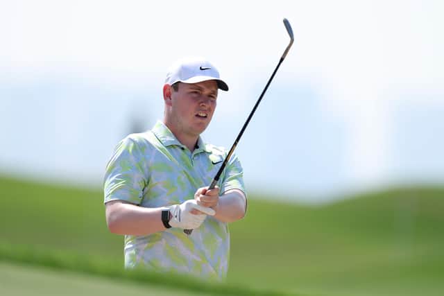 Bob MacIntyre splashes out of a bunker in the opening round of the Abu Dhabi HSBC Championship at Yas Links.