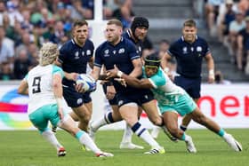 Finn Russell is collared by South Africa during Scotland's defeat at the 2023 World Cup.