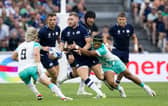 Finn Russell is collared by South Africa during Scotland's defeat at the 2023 World Cup.