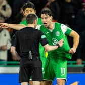 Hibs captain Joe Newell argues with referee Colin Steven after Mykola Kuharevich is sent off and a penalty awarded to Dundee United following a VAR review. (Photo by Ross Parker / SNS Group)