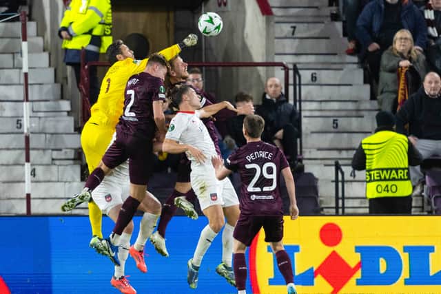 Hearts goalkeeper Craig Gordon punches the ball clear against Heidenheim.
