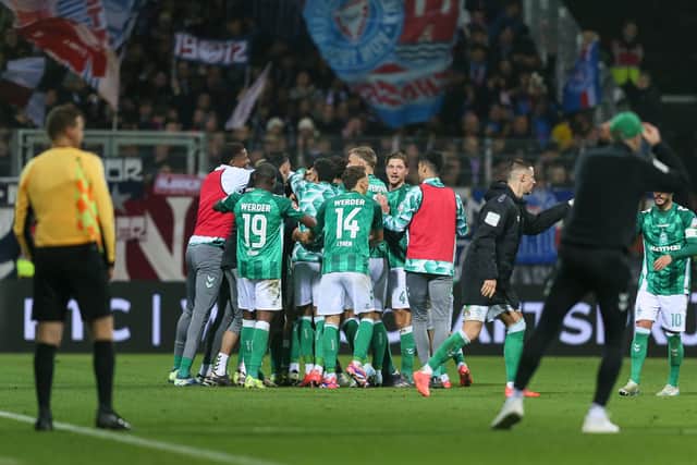 Werder Bremen celebrate Oli Burke's late goal against Holstein Kiel.