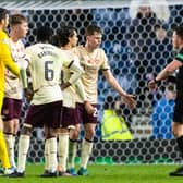Hearts players surround referee Matthew MacDermid after the final whistle following the 1-0 defeat to Rangers at Ibrox. (Photo by Alan Harvey / SNS Group)