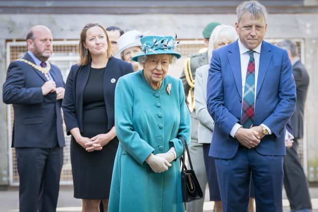 Queen Elizabeth II, with Edinburgh University principal and vice-chancellor Sir Peter Mathieson (right), during a visit to the Edinburgh Climate Change Institute in 2021