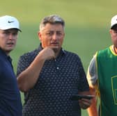 Bob MacIntyre chats with his coach Simon Shanks and caddie Mike Burrow during the Rolex Pro-Am prior to the DP World Tour Championship at Jumeirah Golf Estates in Dubai