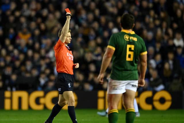 Referee Christophe Ridley shows a red card after Scott Cummings' offence was upgraded while he was in the sin-bin.