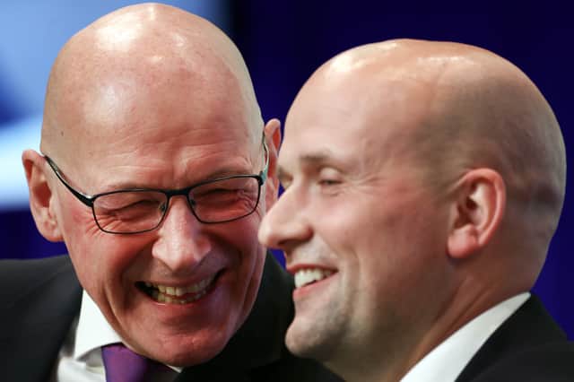 John Swinney and Stephen Flynn share a lighter moment earlier this year (Picture: Jeff J Mitchell)