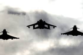 Two Typhoons and a Tornado jet fly past RAF Lossiemouth. Picture: PA