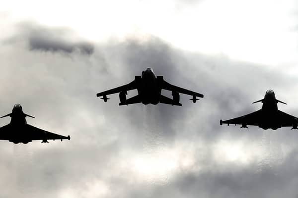 Two Typhoons and a Tornado jet fly past RAF Lossiemouth. Picture: PA