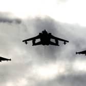 Two Typhoons and a Tornado jet fly past RAF Lossiemouth. Picture: PA