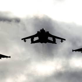 Two Typhoons and a Tornado jet fly past RAF Lossiemouth. Picture: PA