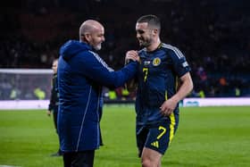Scotland head coach Steve Clarke embraces goal scorer John McGinn at full time.
