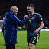 Scotland head coach Steve Clarke embraces goal scorer John McGinn at full time.