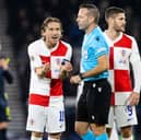 Croatia's Luka Modric complains to referee Orel Grinfeeld after the red card for Petar Sucic during the 1-0 defeat to Scotland at Hampden. (Photo by Alan Harvey / SNS Group)
