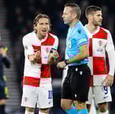 Croatia's Luka Modric complains to referee Orel Grinfeeld after the red card for Petar Sucic during the 1-0 defeat to Scotland at Hampden. (Photo by Alan Harvey / SNS Group)