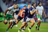Scotland's Darcy Graham breaks free to score his side's fourth try and equal the national team's try record.