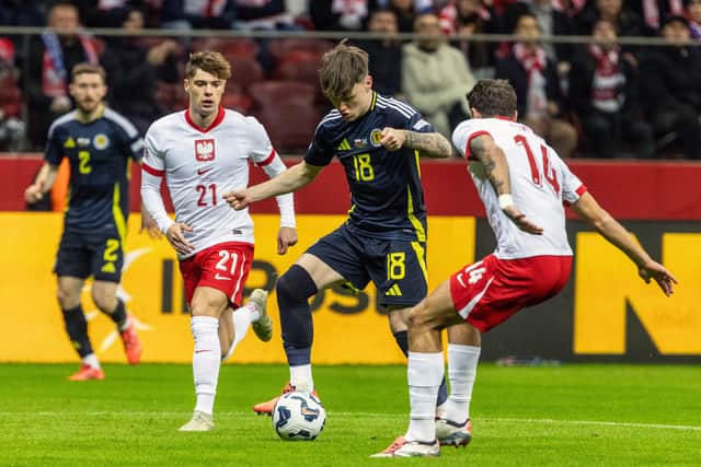 Scotland winger Ben Doak takes on the Poland defence. (Photo by WOJTEK RADWANSKI/AFP via Getty Images)