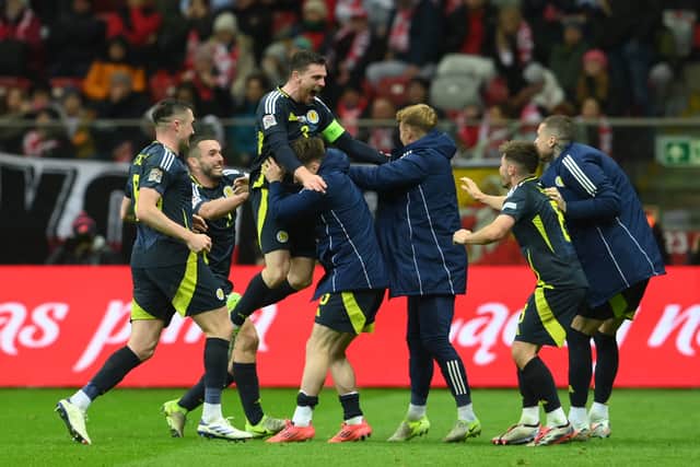 Andy Robertson celebrates scoring Scotland's injury-time winner against Poland in Warsaw. (Photo by Adam Nurkiewicz/Getty Images)