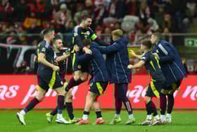 Andy Robertson celebrates scoring Scotland's injury-time winner against Poland in Warsaw. (Photo by Adam Nurkiewicz/Getty Images)