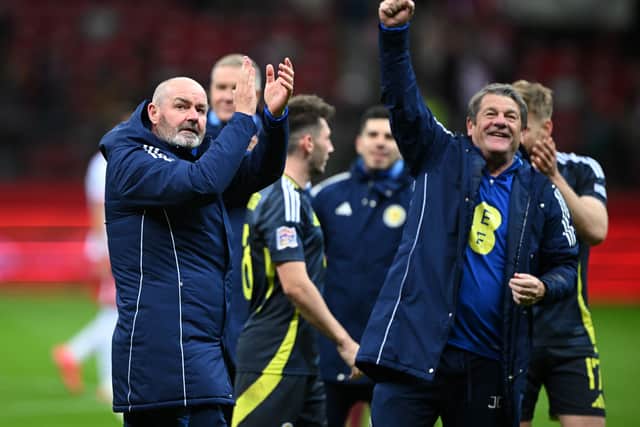 Scotland manager Steve Clarke and assistant John Carver celebrate after the win over Poland in Warsaw.