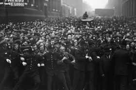 Police hold back a crowd outside Strangeways gaol in Manchester before the execution of Dr Buck Ruxton for the murder of his wife Isabella Ruxton and her maid Mary Rogerson (Picture: Fox Photos)