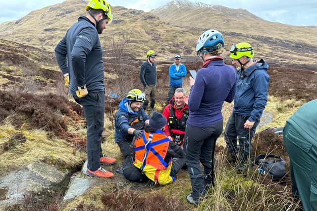 Glenn Campbell receives treatment in the early stages of the mountain climb