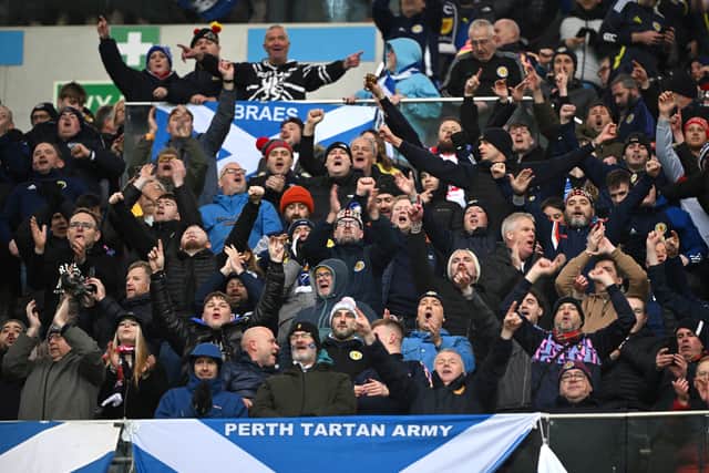 Scotland fans celebrate after the 2-1 win over Poland in Warsaw.