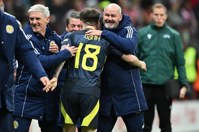 Scotland manager Steve Clarke celebrates with Ben Doak after the win over Poland in Warsaw.