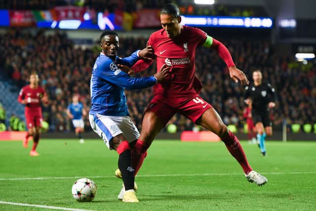 Rangers' Fashion Sakala (L) and Liverpool's Virgil van Dijk during a UEFA Champions League match between Rangers and Liverpool at Ibrox Stadium in 2022. Cr: SNS Group.