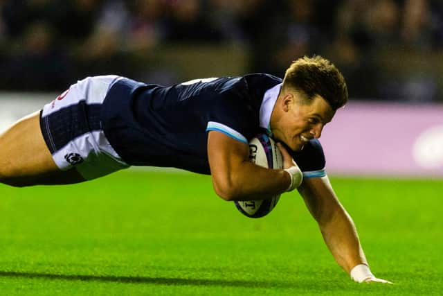 Scotland's Huw Jones scores the first of his two tries against Fiji.