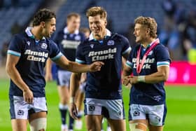 Huw Jones, centre, with Scotland team-mates Adam Hastings and Darcy Graham.