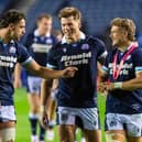 Huw Jones, centre, with Scotland team-mates Adam Hastings and Darcy Graham.