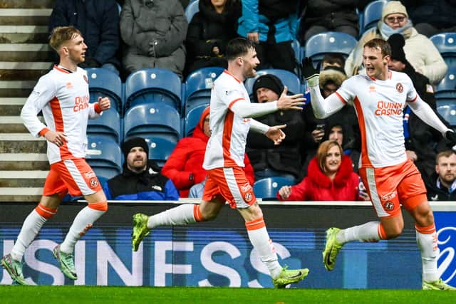Dundee United's Sam Dalby (R) celebrates scoring to make it 1-0.