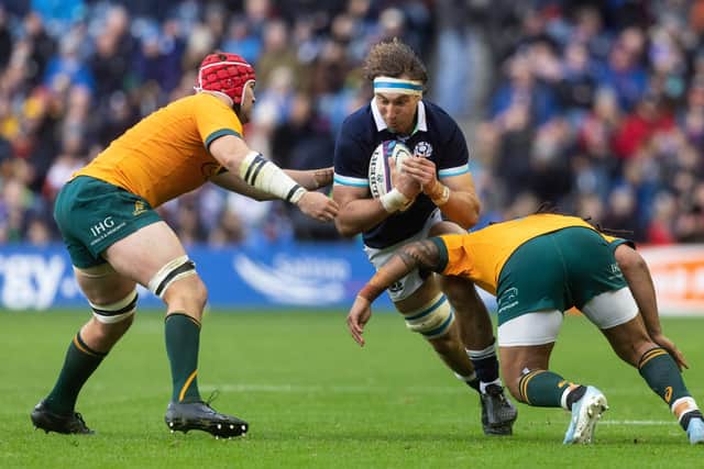 Jamie Ritchie powers through the Australia defence.