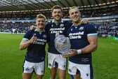 Scotland's Darcy Graham, Blair Kinghorn and Duhan van der Merwe with the Hopetoun Cup at full time.