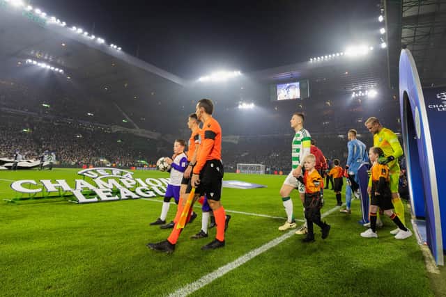 The teams walk out onto the park during a UEFA Champions League 2024/25 League Phase MD4 match between Celtic and Leipzig at Celtic Park. Cr: SNS Group.
