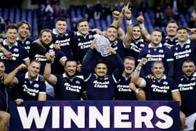 Sione Tuipulotu lifts the Hopetoun Cup after Scotland's win over Australia.