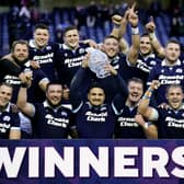 Sione Tuipulotu lifts the Hopetoun Cup after Scotland's win over Australia.