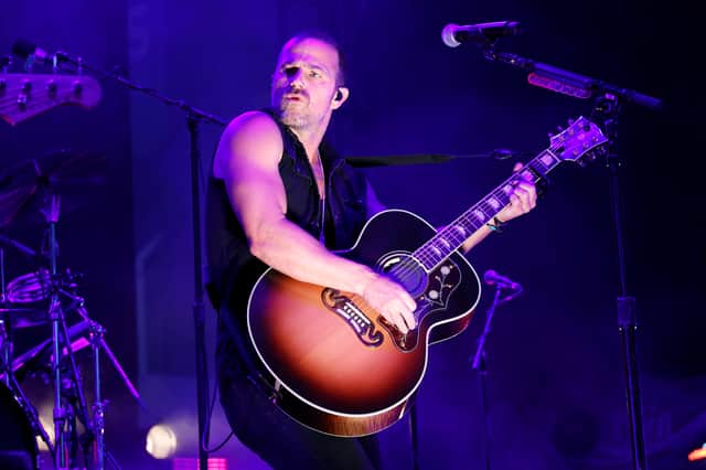 Kip Moore performing onstage.